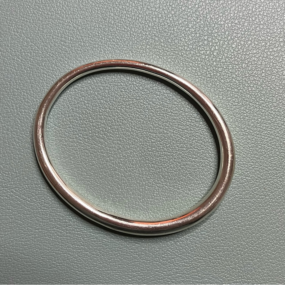Simple Tapered Bangle from Kate Jones jewelry Ursa Major. Solid sterling silver.